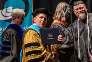 President Roache and Graduate